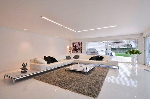 Living room with barrisol acoustics on the ceiling